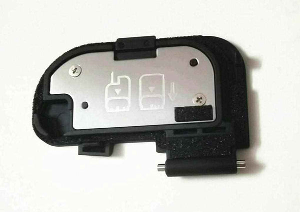 Camera battery door cover repair part, black plastic with metal insert and hinges