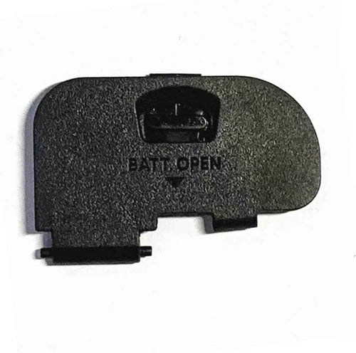 Battery door cover, black textured plastic with latch tab and embossed marking