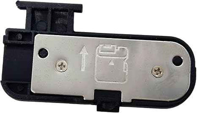 Camera battery chamber cover with silver metal plate and black plastic frame