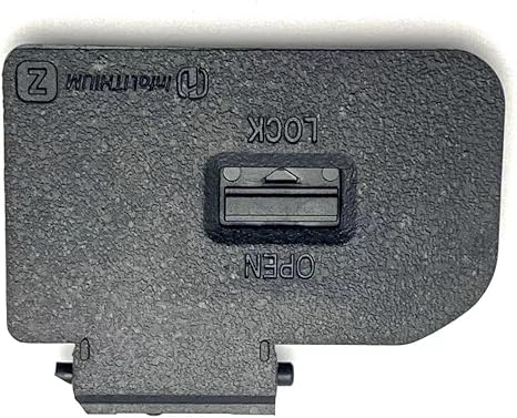 Dark gray battery door cover with latch slot and mounting tabs for camera repair